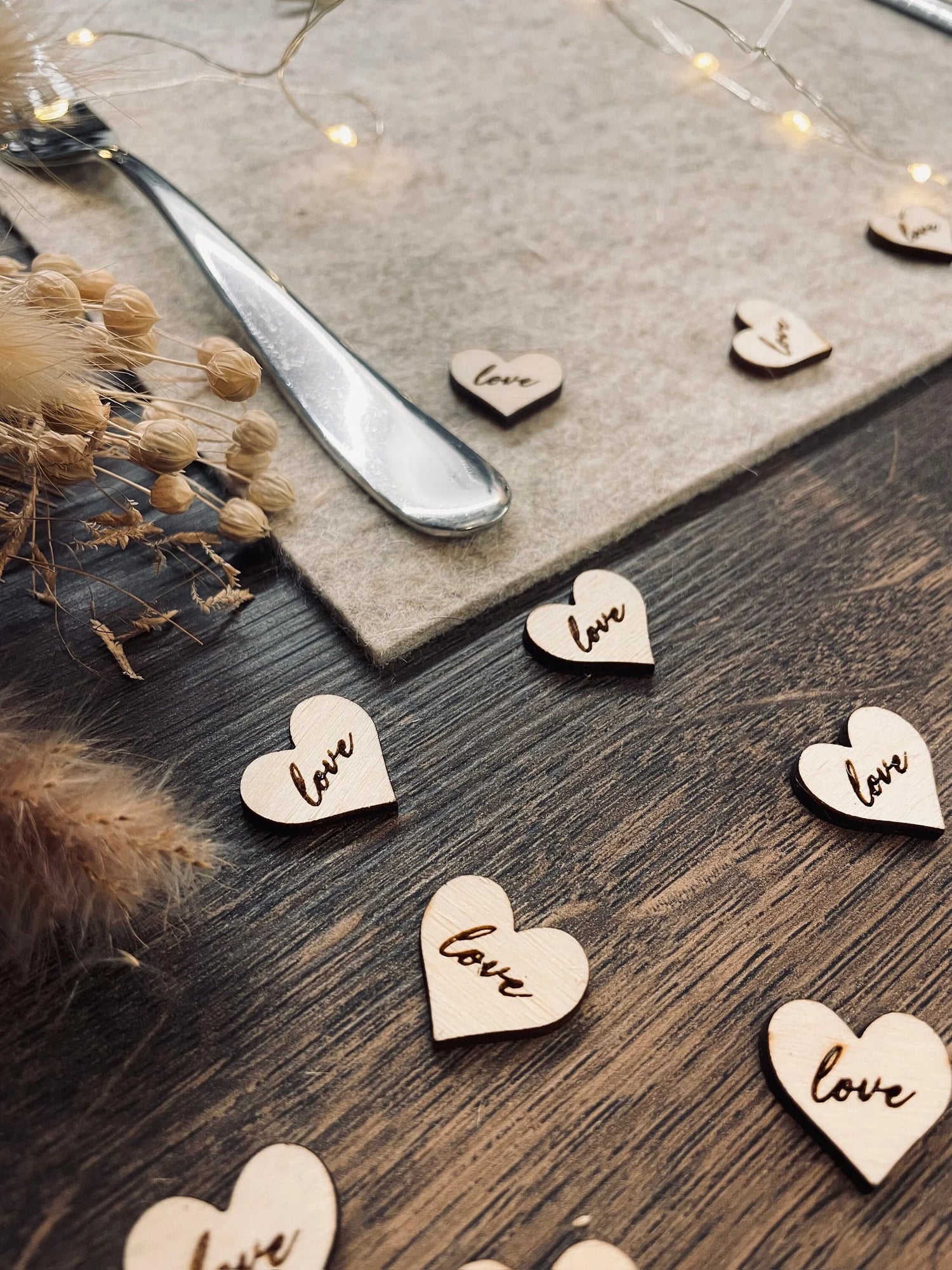 Cotswolds Laser Company Wooden Heart Cut Outs that are used as wedding table confetti